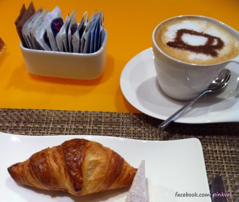 Italian breakfast: Cappuccino and croissant